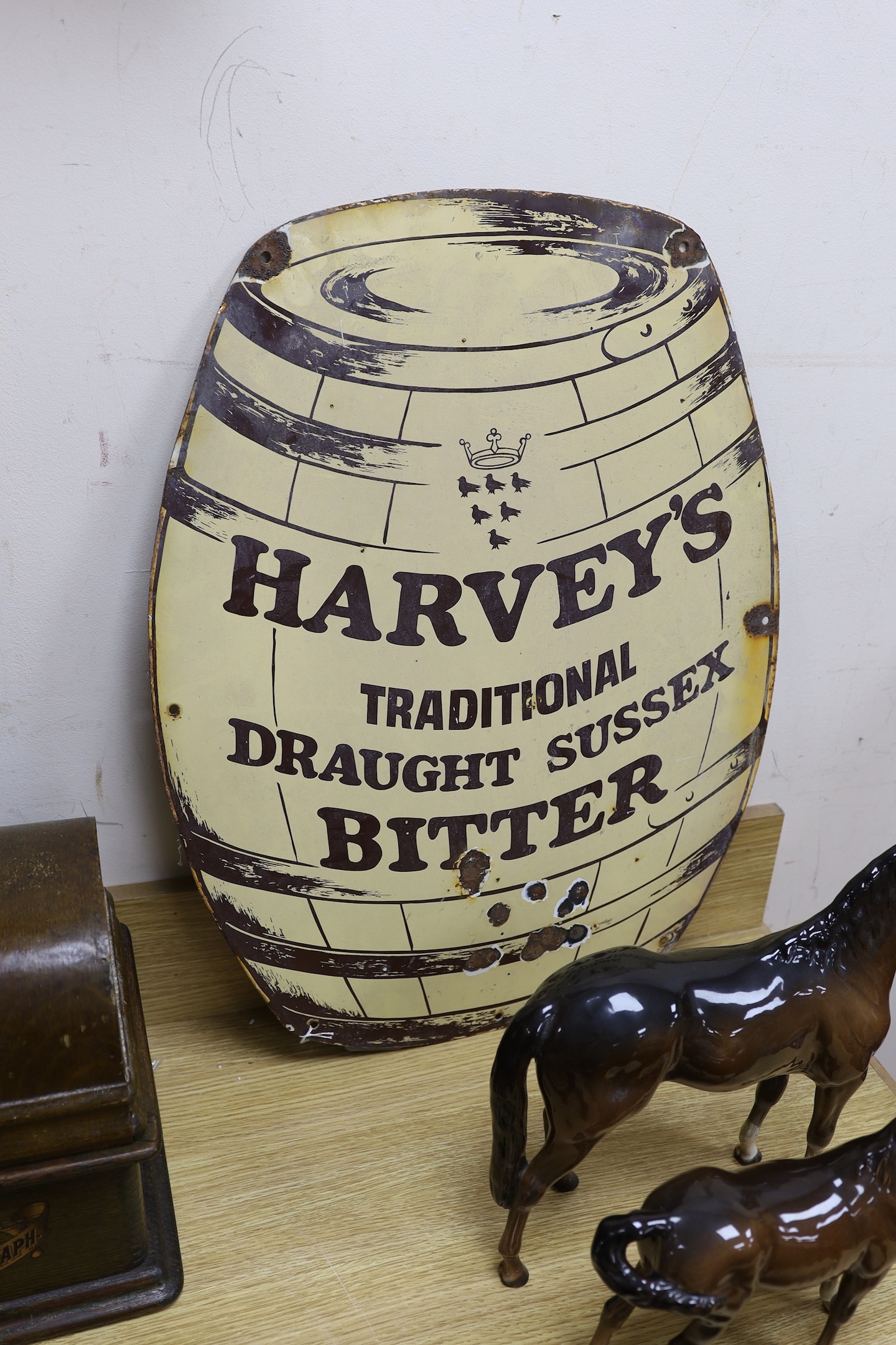 A Harvey's traditional draught Sussex bitter keg enamel sign, with air rifle damage. 62cm tall